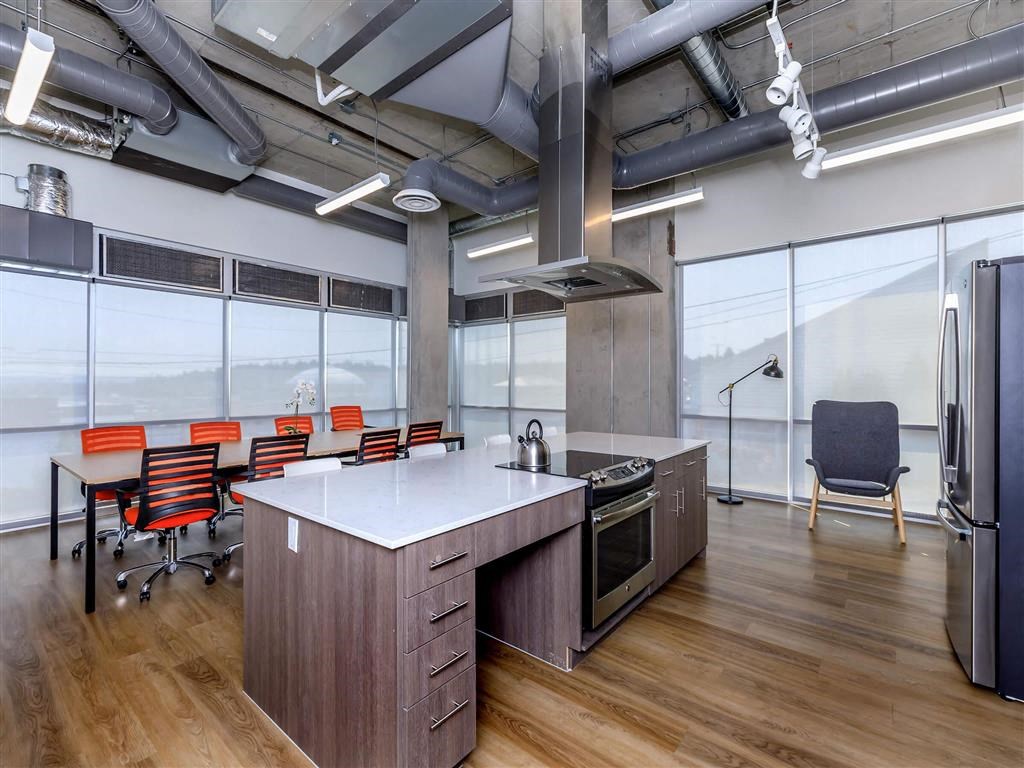 a kitchen and dining area in an office at Jefferson Yards, Washington