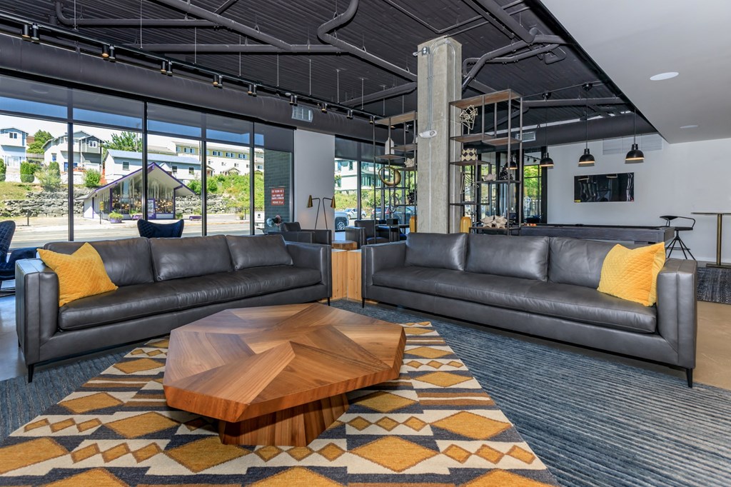 a large living room with couches and a coffee table at Napoleon Apartments, Tacoma, 98402