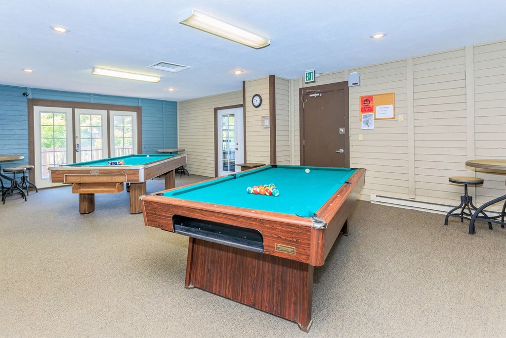 a game room with two pool tables and two billiards a game room with two pool tables and two billiards at Lincoln Village Apartments, Spokane, WA