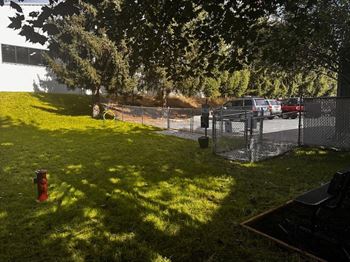 A red fire hydrant is on a green lawn at Ironwood Apartments, Coeur d'Alene, ID, 83814
