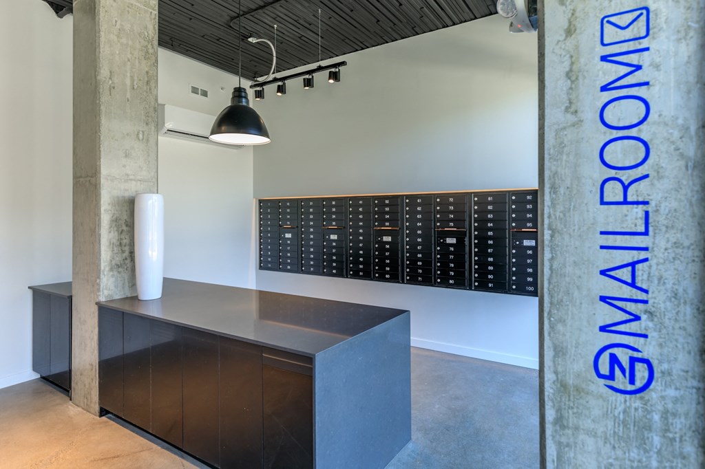 a desk with a lamp and a calendar on the wall at Napoleon Apartments, Tacoma, 98402