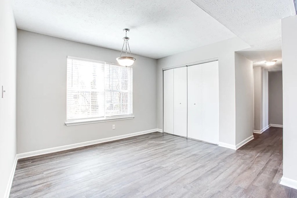 A room with a window and a wooden floor at Barcelo at East Cobb Apartments, Marietta, Georgia