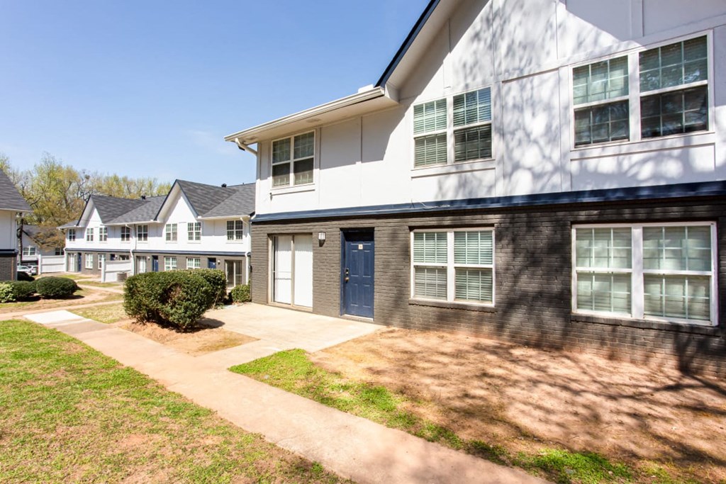 A white house with a blue door and windows at Barcelo at East Cobb Apartments, Marietta, Georgia