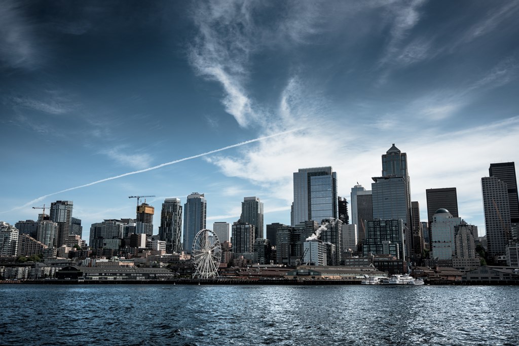 a view of the city skyline from a boat on the water