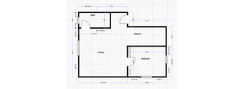 A floor plan of a house with a living room, kitchen, bedroom and bathroom.