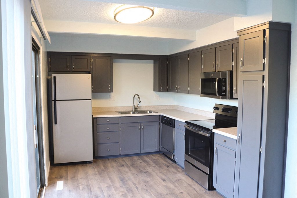Renovated Townhome Kitchen with Stainless Steel Appliances