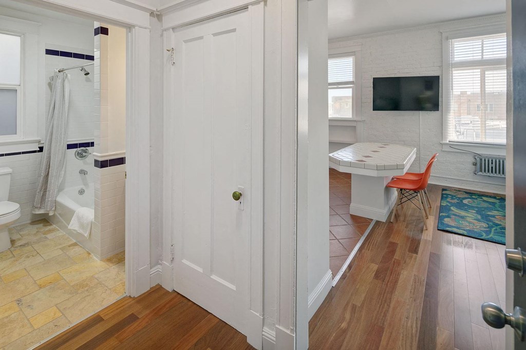 a view of a bathroom with a shower and a sink