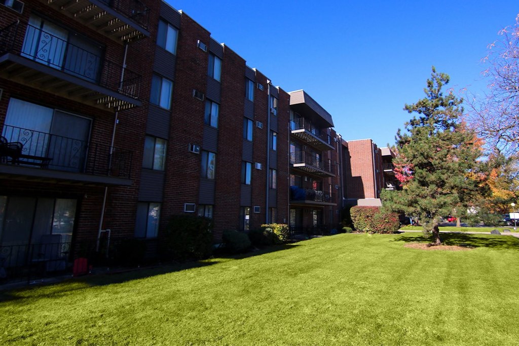 Brick Apartment Building and Landscape at Lansing Riverwood, LLC, Lansing