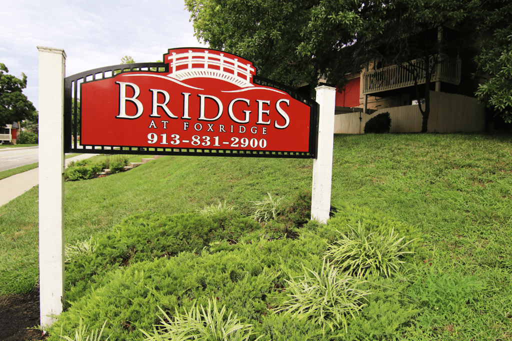 A red sign with white lettering that says "Bridges" on it.