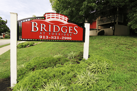 A red sign with white lettering that says "Bridges" on it.