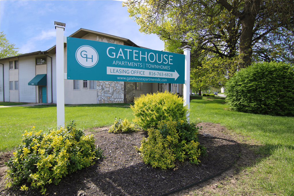 the gatehouse apartments sign in front of a building at Gatehouse Apartments, Kansas City, MO, 64134