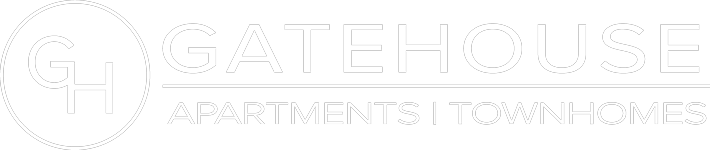 A logo for Gatehouse Apartments and Townhomes.