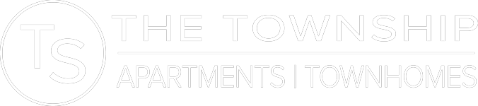 A logo for a company called The Township that offers apartments and townhomes.