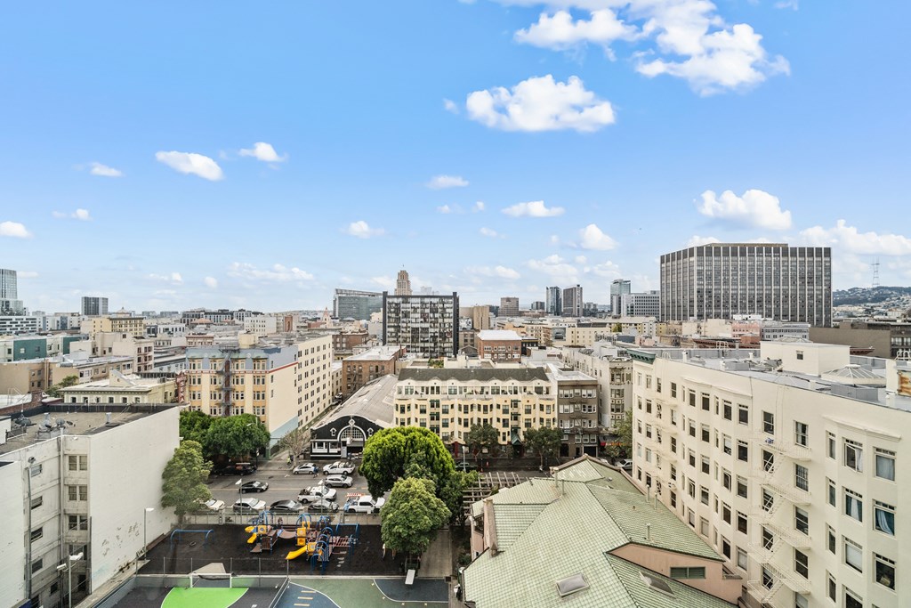 the view of the city from the roof of a building