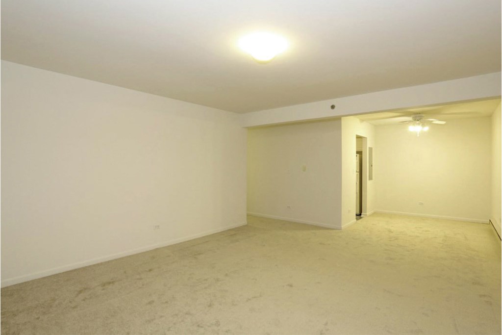 Carpeted Living Room at Lansing Riverwood, LLC, Lansing, IL, 60438