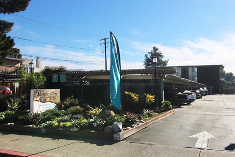 A sign for Marine View Plaza is visible in front of a building.