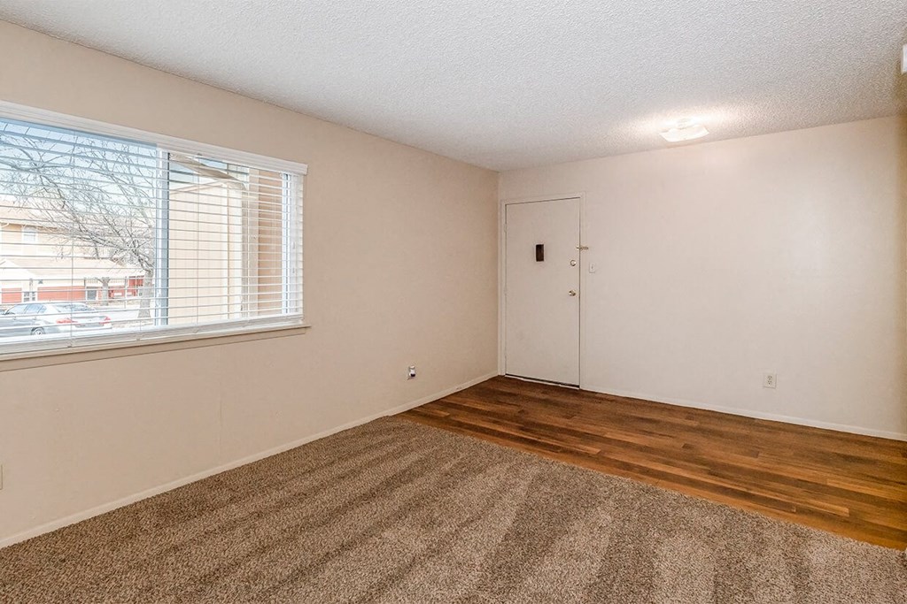 East One Bedroom Living Room and Entry at Raintree Apartments, Topeka, KS