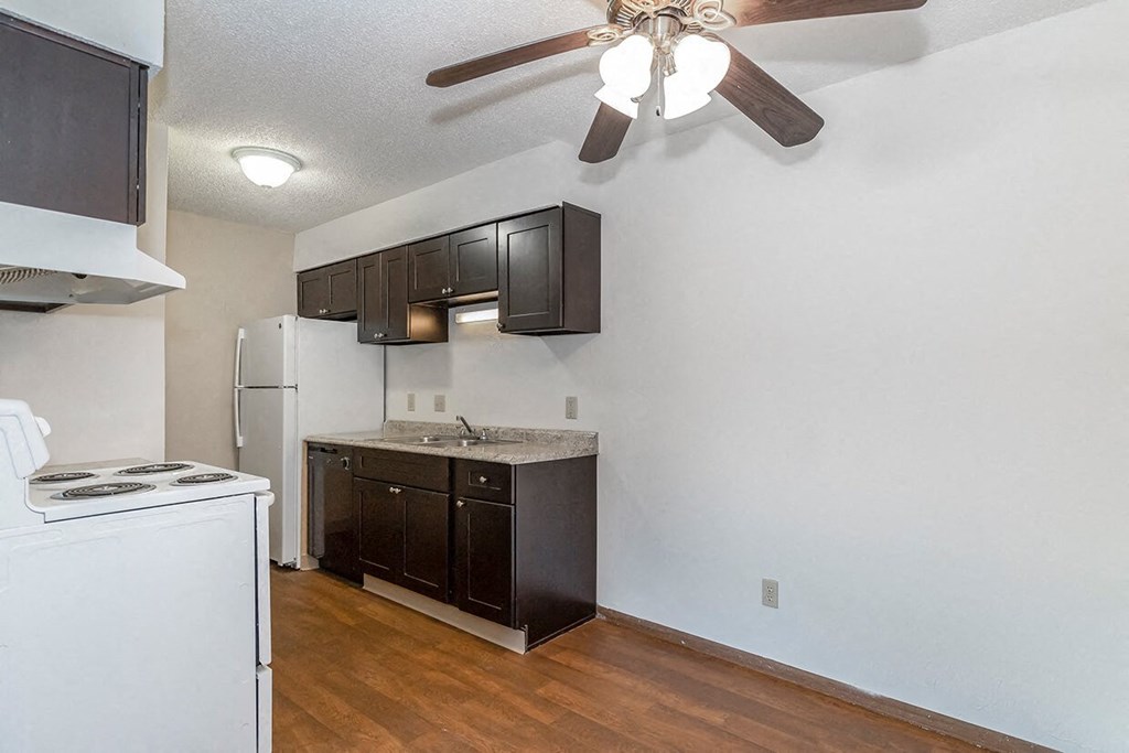 West Two Bedroom Kitchen and Ceiling Fan at Raintree Apartments, Topeka