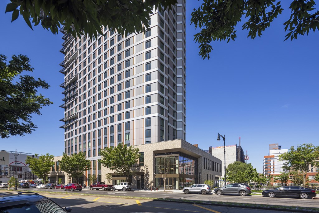 a rendering of a tall building on a city street