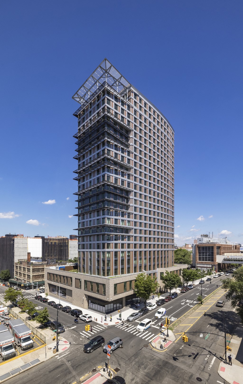 an aerial view of a tall building in a city