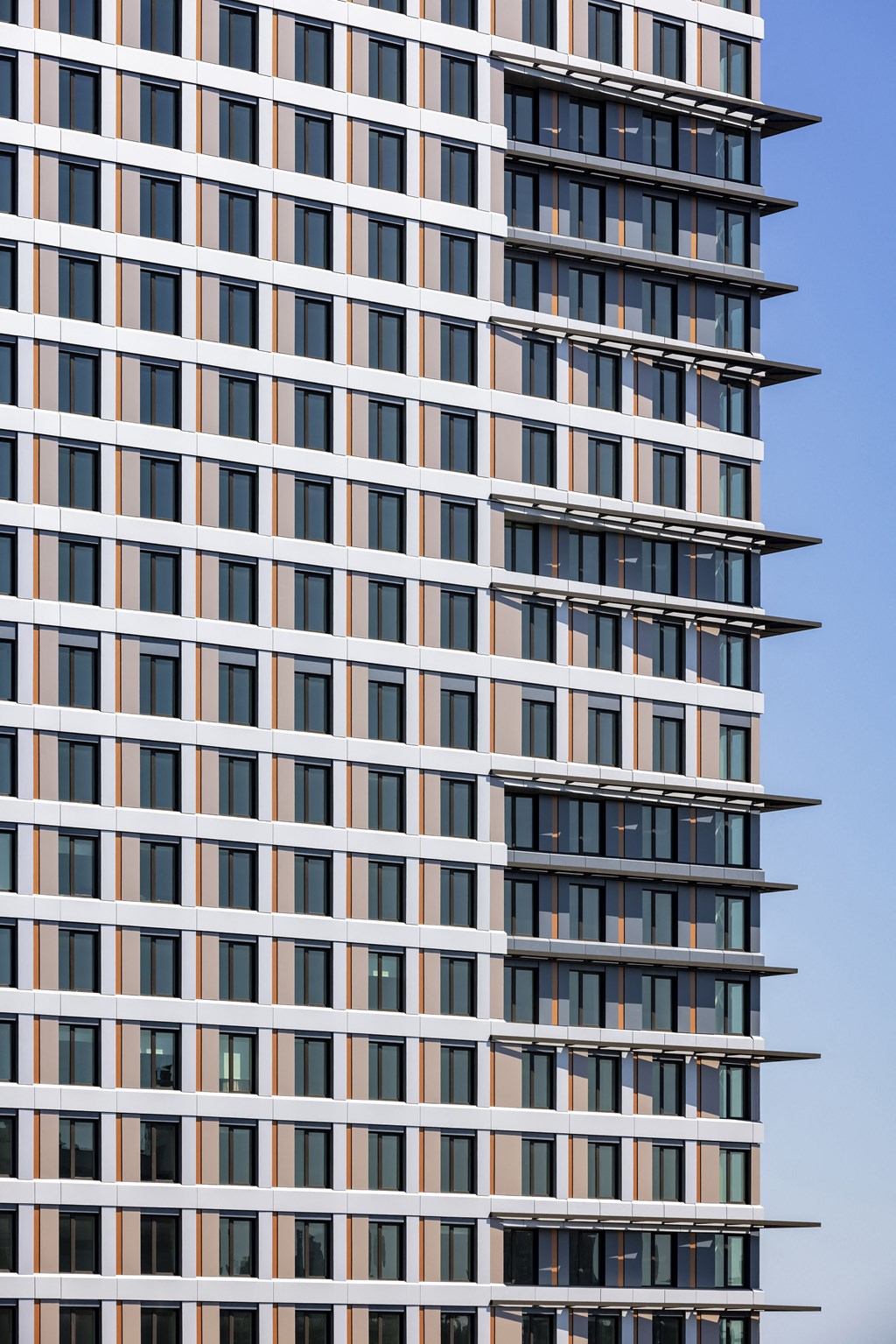 the facade of an office building with many windows