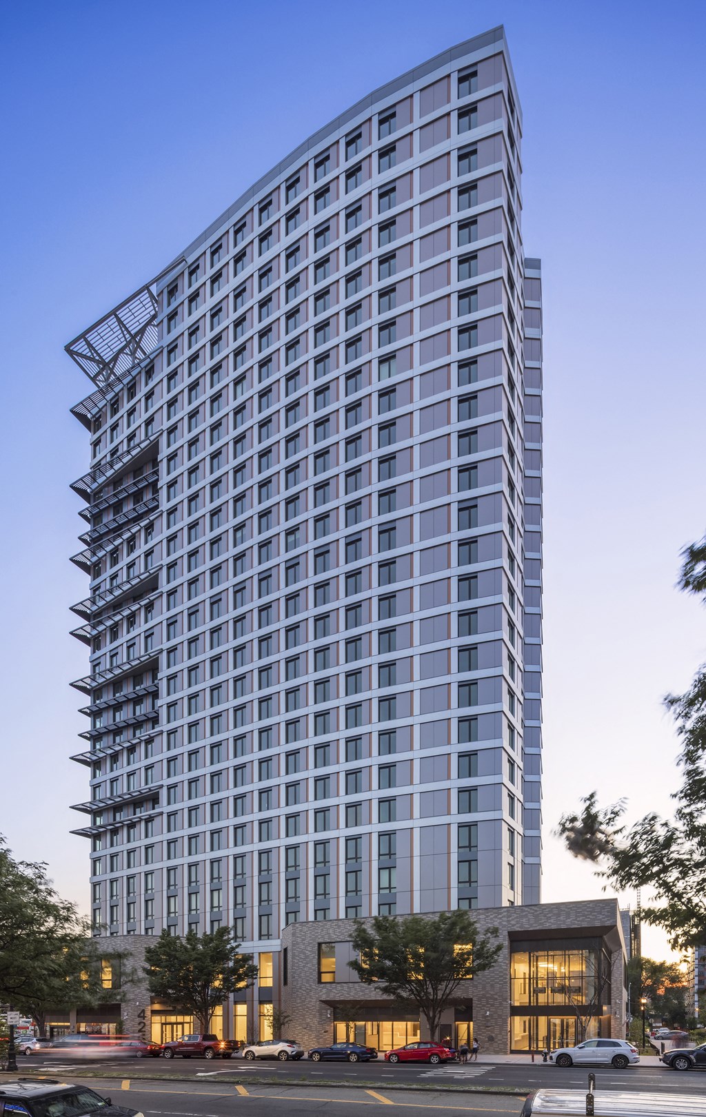 a rendering of a tall apartment building on a city street