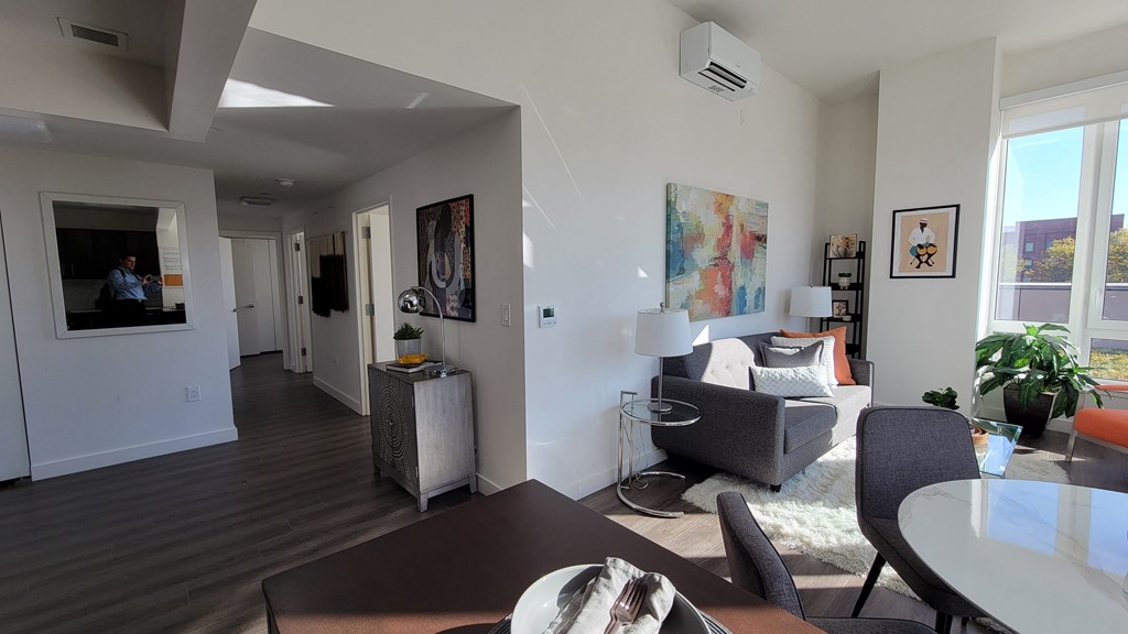 a living room and dining room in an apartment