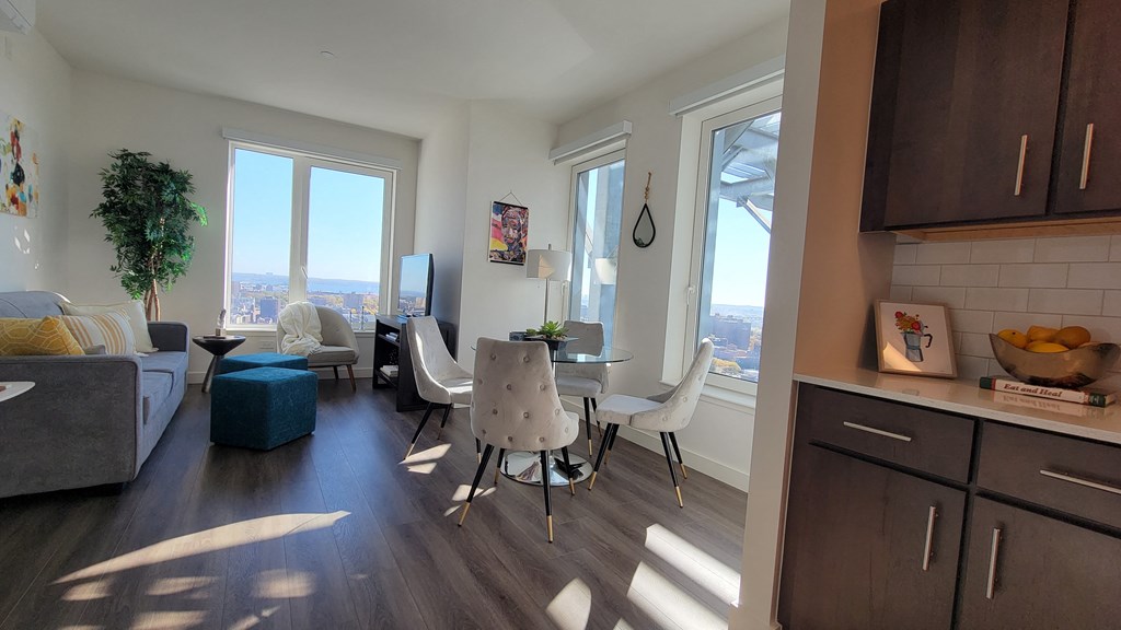 an open living room and dining room with a table and chairs