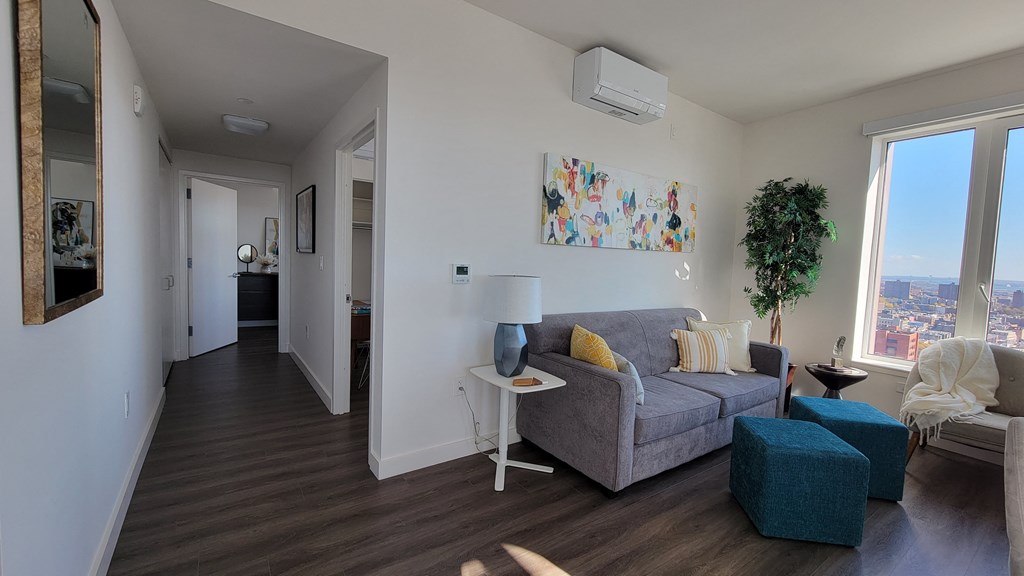 a living room with a couch and a window