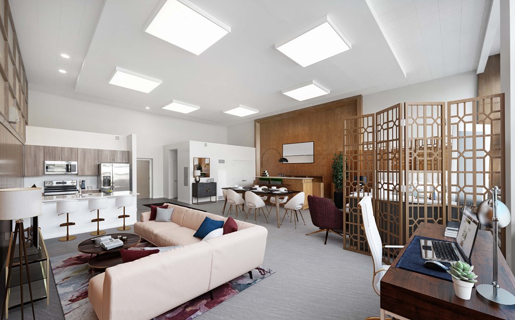 a living room with a white couch and a table with chairs