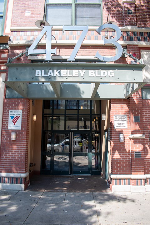 The Blakeley Building is a red brick building with a large number 473 on top.