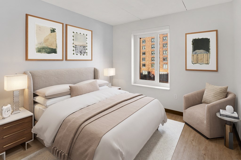 a bedroom with a bed and a chair