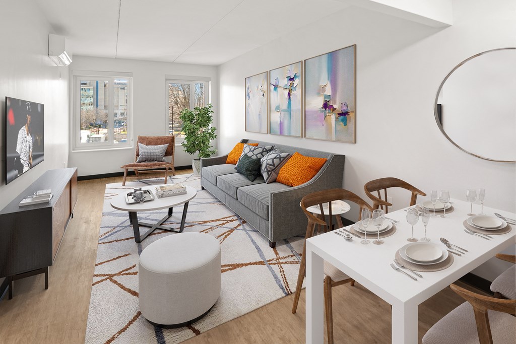 a living room with a white table and a gray couch