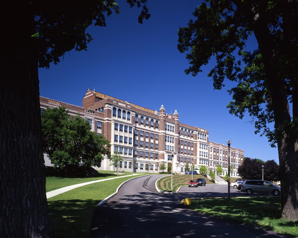 a picture of a large building with a blue sky in the background