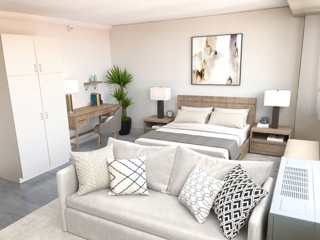 a living room with two beds and a couch