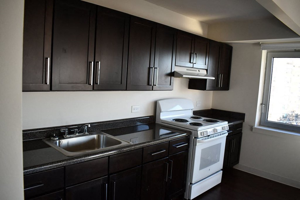 a kitchen with a stove and a sink