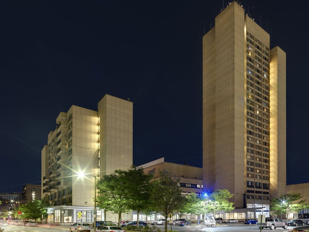 a city at night with tall buildings