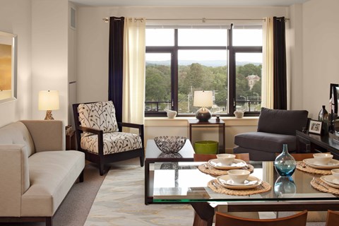A living room with a couch, chair, and coffee table.