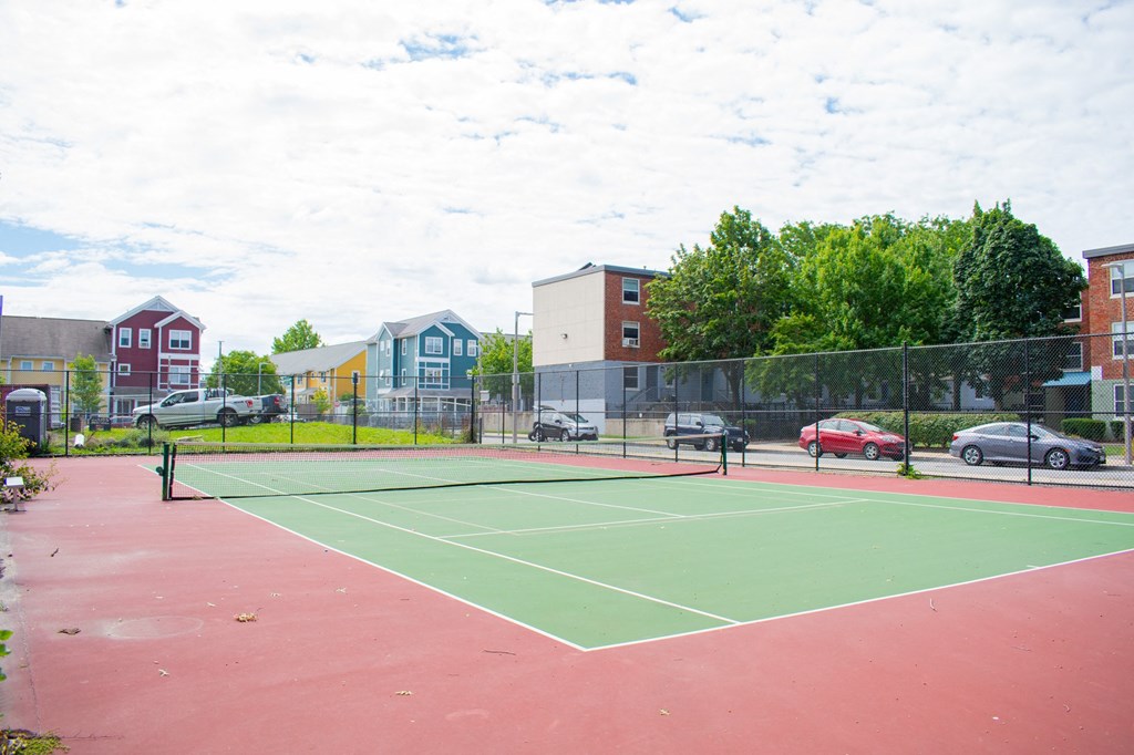 tennis courts at the enclave at woodbridge apartments in sugar land, tx