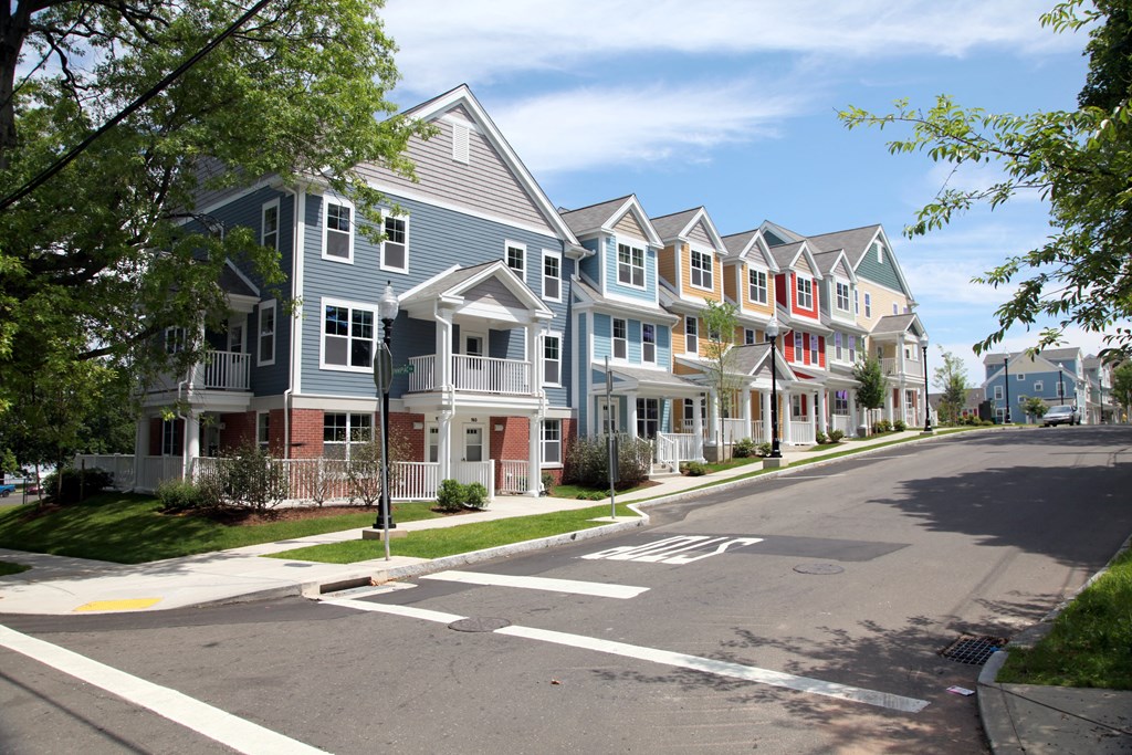 a row of town houses on the corner of a street