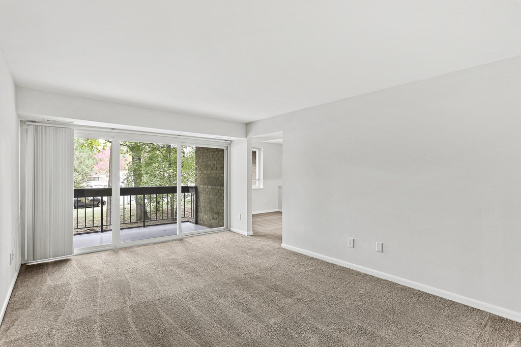 living room and a walk out private balcony
