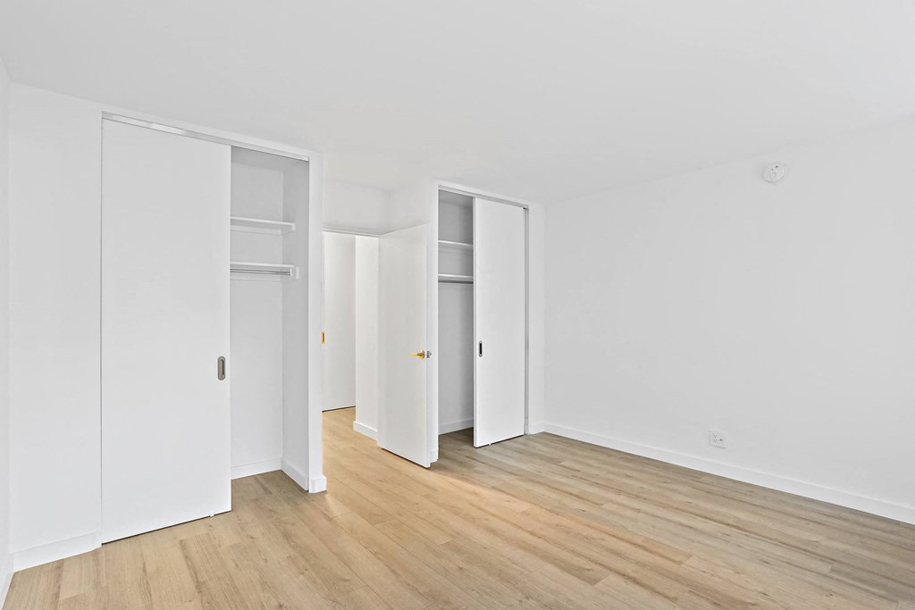 bedroom with two closets