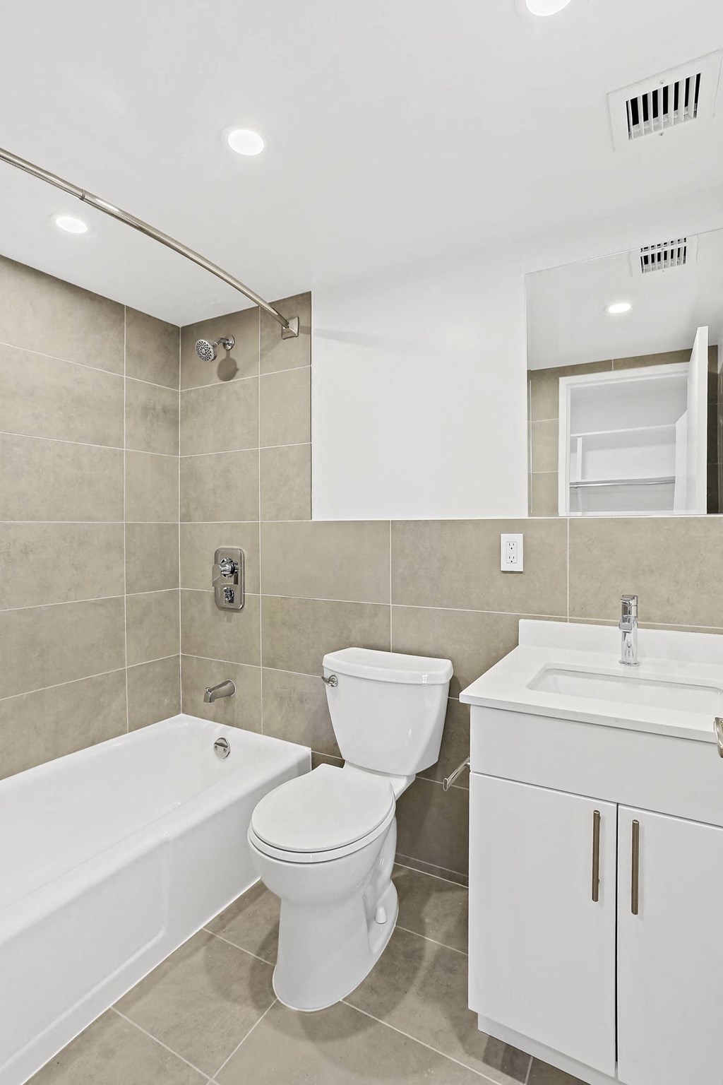 a bathroom with a toilet and a tub and a sink