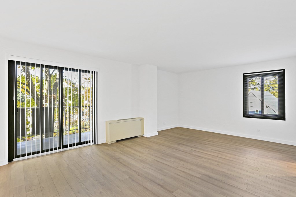 living room with a glass door to a balcony