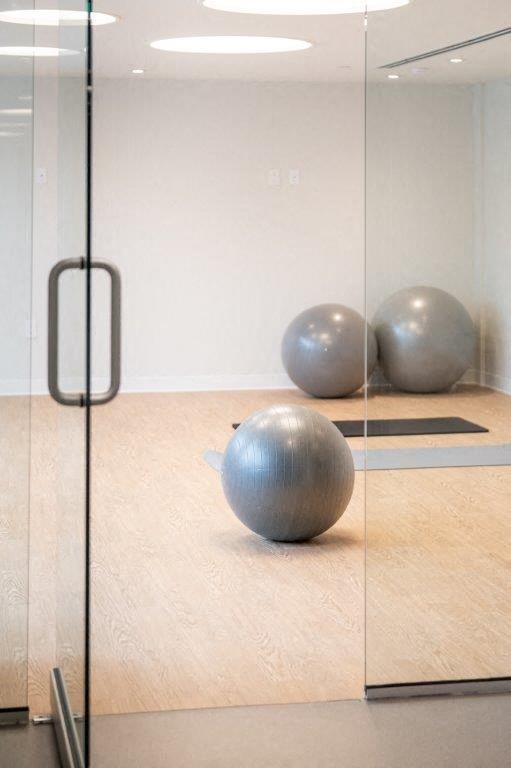 two spheres in a room with a glass door