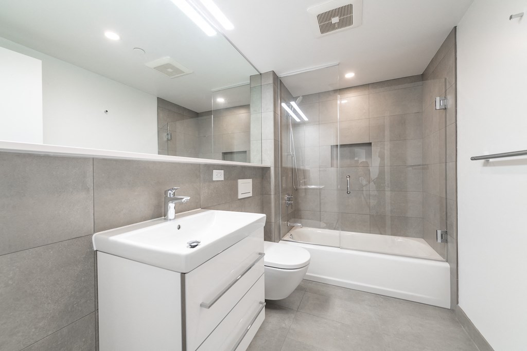 a bathroom with a sink toilet and a shower