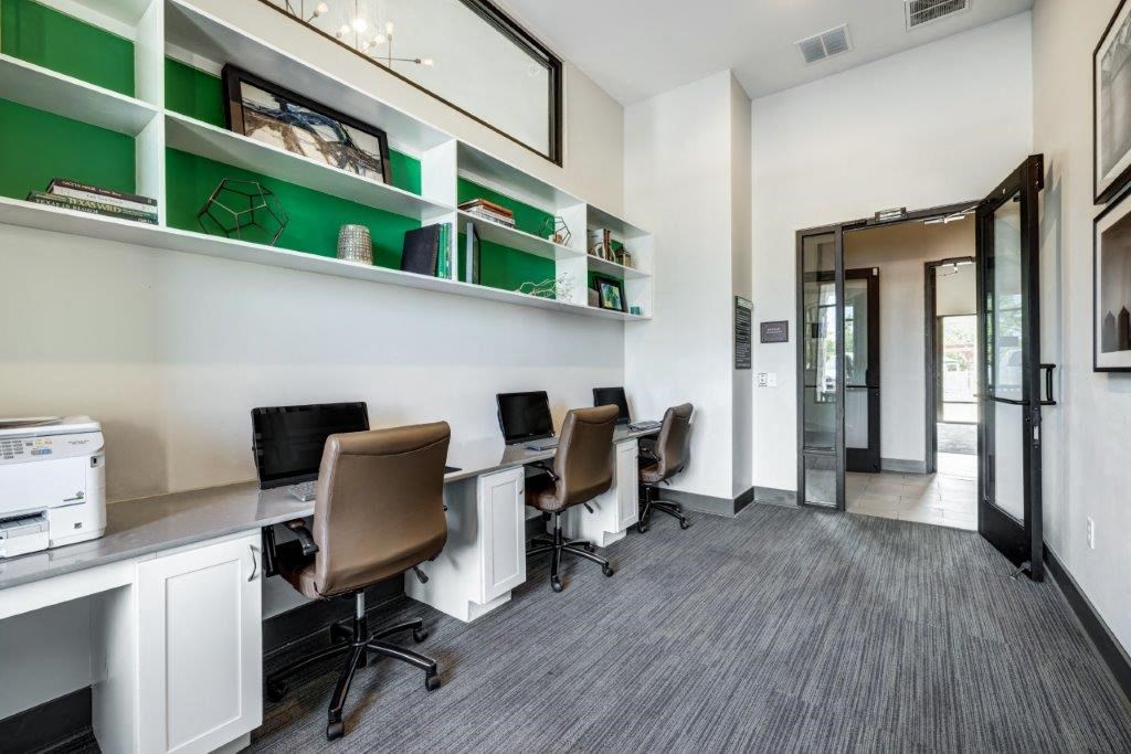 a office with desks and chairs in a building