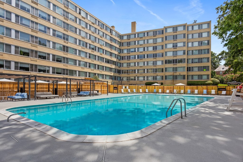 a swimming pool at a hotel in front of a building