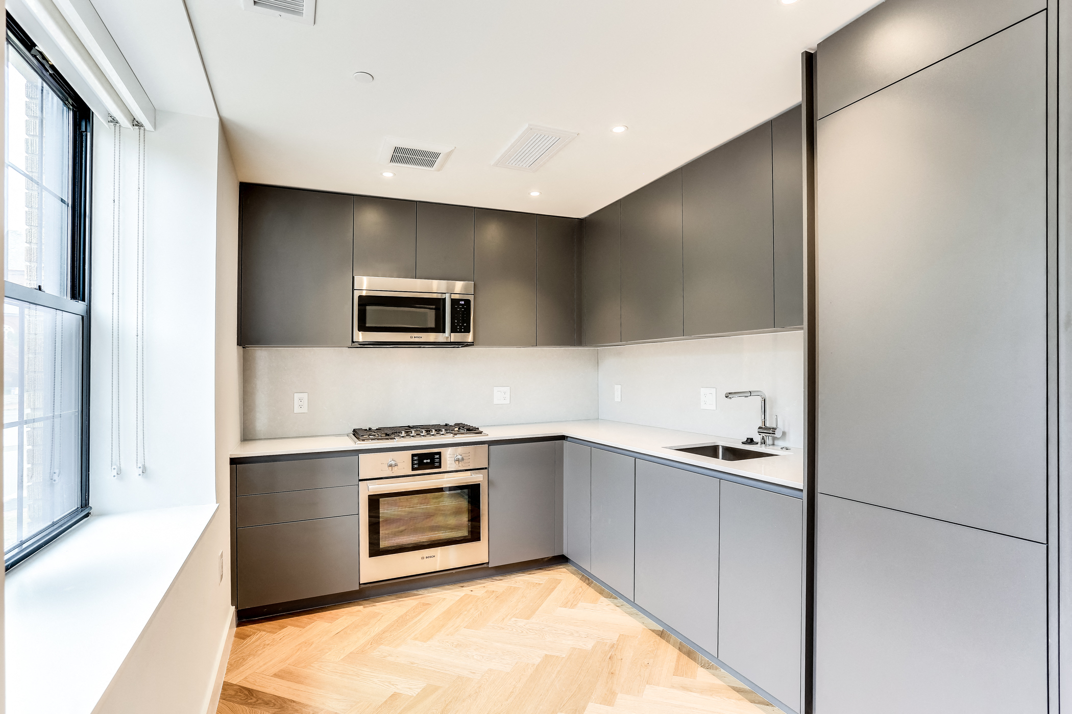 Studi apartment kitchen with European finished and hardwood floors