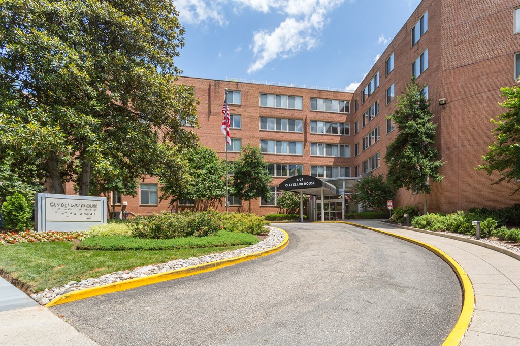 A building with a flag on it and a sign that says Questar.